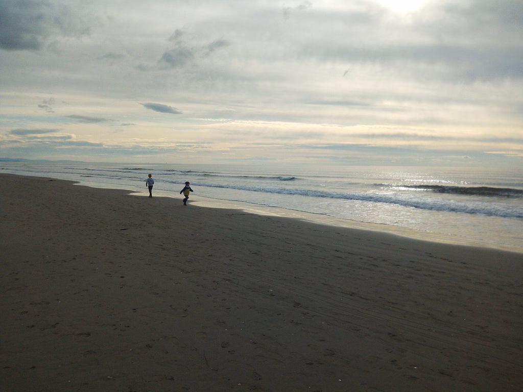 A broad, quiet stretch of sand and sea at Marina di Pietrasanta