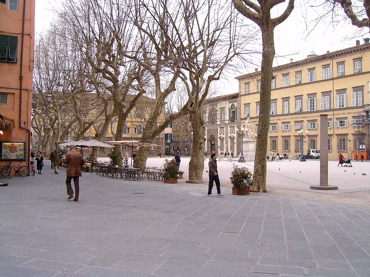 The plane tree-lined Piazza Napoleone in Lucca, with Palazzo Ducale and the monument to Maria Luisa of Bourbon