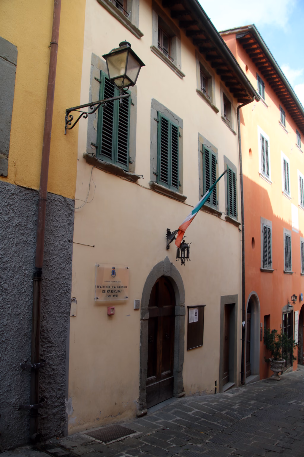 The Teatro dei Rassicurati on a narrow street in Montecarlo