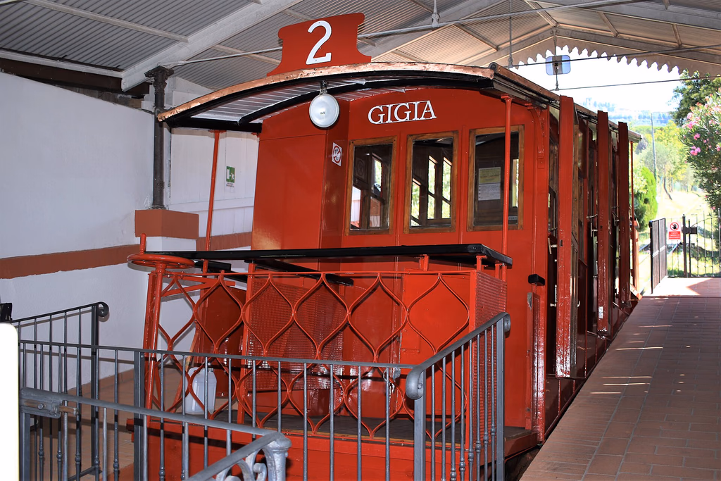 The red Gigia funicular car at Montecatini Terme station
