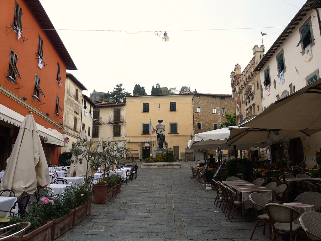 Restaurant terraces and old buildings around Piazza Giusti in Montecatini Alto