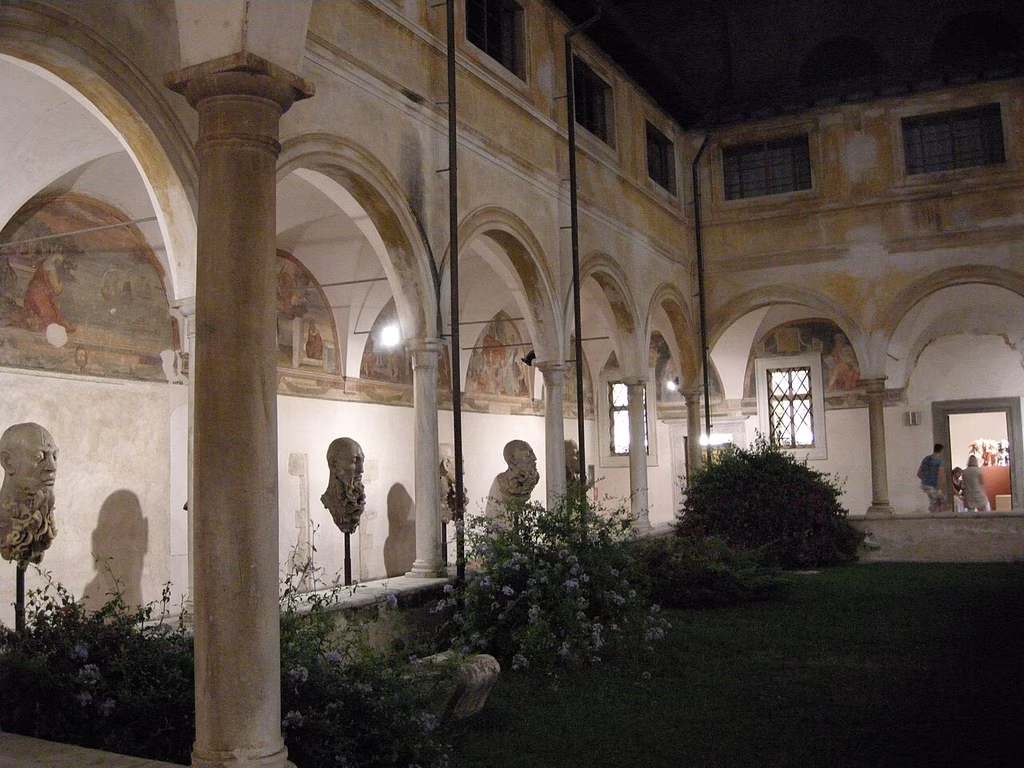 The arcaded cloister of Sant’Agostino with sculptures among the columns