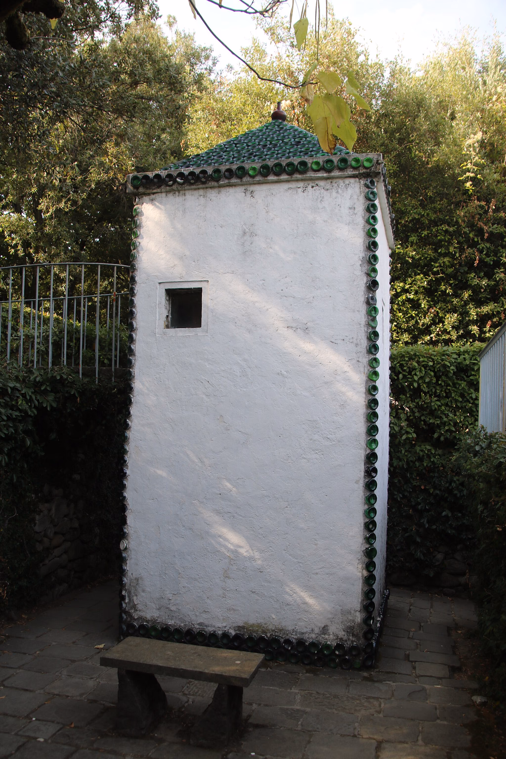 The small blue Fairy House surrounded by trees in Pinocchio Park
