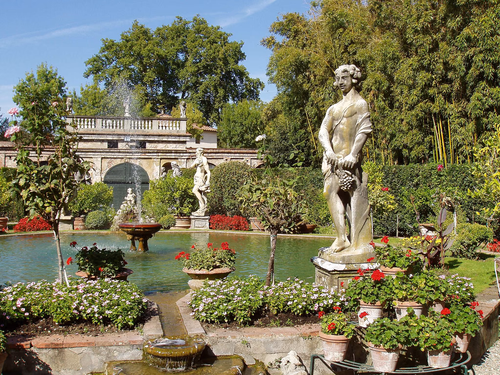 Classical statues, fountains and flowering borders in the Baroque garden of Palazzo Pfanner